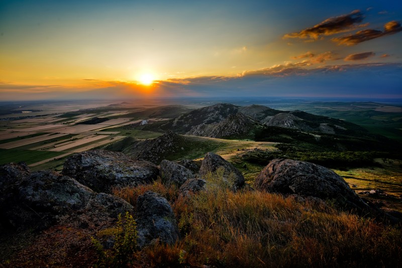 Sun rising over rocks